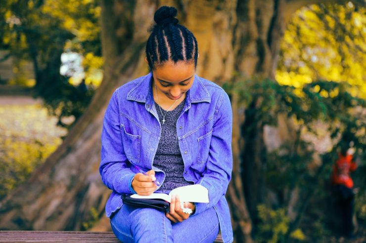 Picture of a young person reading poetry.